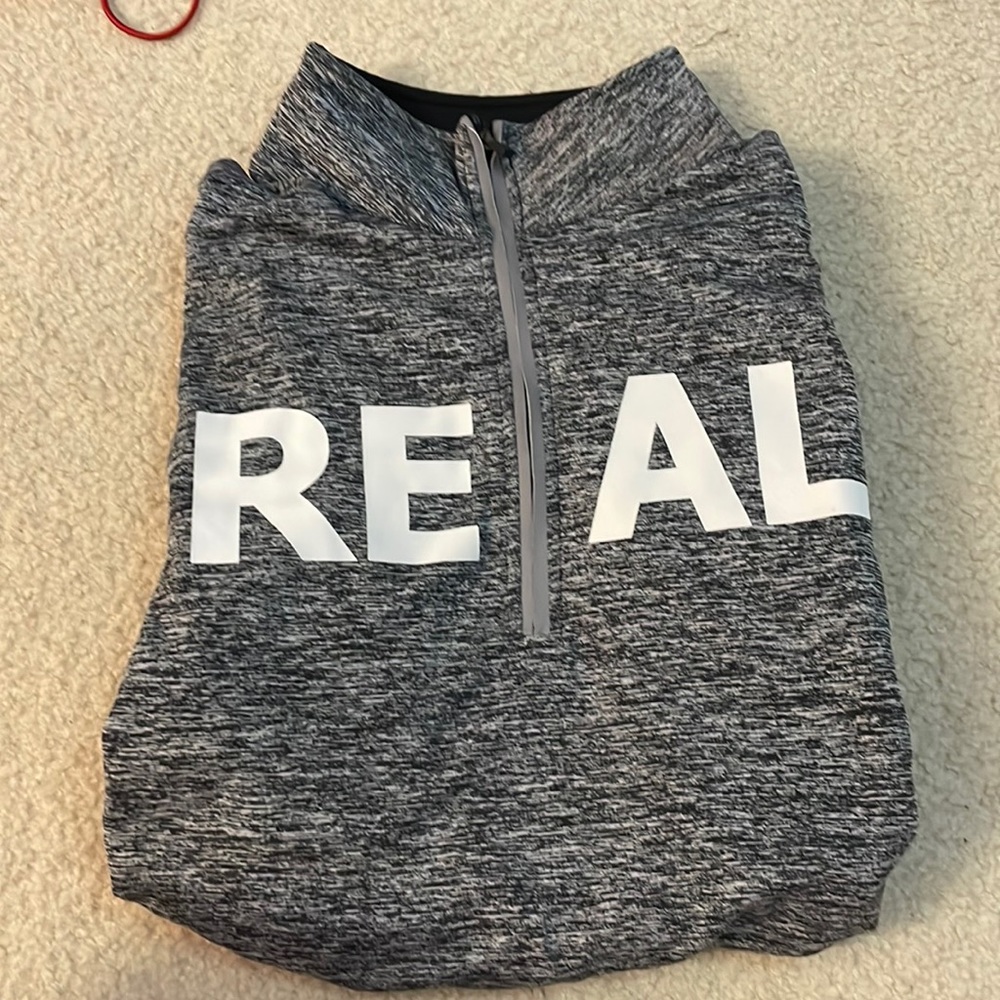 Quarter zip with finger holes